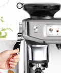 Certified Remanufactured Automatic Espresso Machine With Built In Grinder And Steam Wand, close-up view with power button.