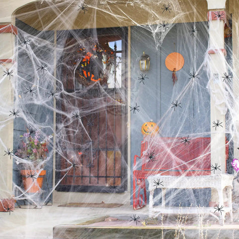 Premium Super Stretchy Halloween Spider Webs Covering 1400 Square Feet With 150 Extra Fake Spiders on a decorated porch.