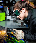 Premium Flip Up Welding Goggles With Soft Comfort Frame And Adjustable Headband Dustproof Industrial Safety Glasses Built Like A Tank For The Shop Tough As Nails Protection You Deserve worn by a worker in a workshop using a welding tool.