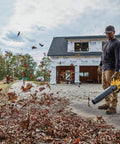 Man using DCBL722BR 20V Max XR Brushless Cordless Handheld Blower Tool Only Renewed For Quick Cleanups with 450 CFM on driveway
