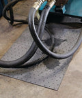 Premium Oil Absorbent Mat Pads 15 x 20 Inches under machinery hoses in workshop