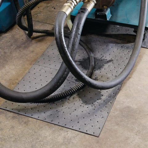 Premium Oil Absorbent Mat Pads 15 x 20 Inches under machinery hoses in workshop