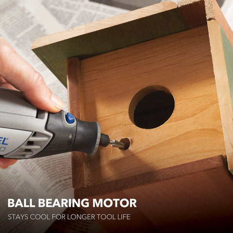 All Purpose Corded Variable Speed Rotary Tool Kit With 6 Speeds drilling into wooden birdhouse, showing ball bearing motor use