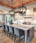 Black Farmhouse Chandelier 4 Light Ceiling Fixture With Height Adjustable Flexible Chain in modern kitchen setting.