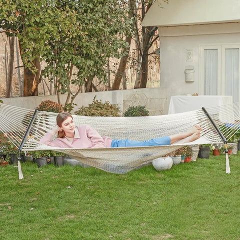 Two Person Rope Hammock With Hardwood Spreader Bar For Indoor Outdoor Use, handwoven Caribbean style, cream, backyard setup.