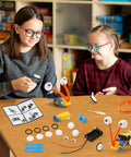 Kids assembling robots with Four Pack Robot Kits For Kids Ages 8 And Up, STEM Crafts And Robotics Projects, Electronics Building Kit