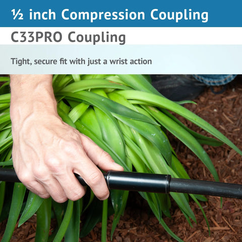 Close-up of 1/2-inch compression coupling on black poly drip irrigation tubing being installed.