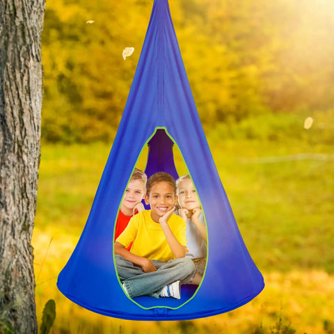 Kids Nest Swing Hammock Chair With Adjustable Rope Indoor Outdoor 40 Inch Blue Pod Swing filled with three kids in a park.