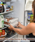 Woman organizing fridge with Egg Holder For Refrigerator With 40 Egg Capacity Two Tray Plastic Design Includes Time Tracker Brush And Nonslip Lid Top No Fuss To Stack And Organize Your Fridge