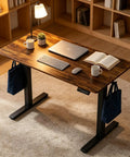 Smooth Height Adjustable Electric Standing Desk Workstation With Heavy Duty Carbon Steel Frame And Quiet Motor For Home Office Or Gaming Setup with laptop.