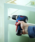 Person using 12V Max EC Brushless 3/8 Inch Drill Driver Bare Tool with Pro Torque 300 In-Lbs, 1,750 RPM in tight cabinet space