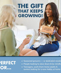 Two women sitting on a couch, one holding a Bonsai Tree Kit For Beginners Grow Your Own Mini Bonsai With Four Varieties Seed Starter Kit Includes Potting Soil Jute Bags Pruning Shears Plant Markers And Easy Step By Step Guides.