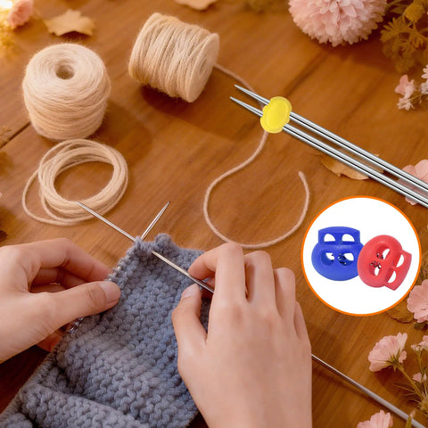 Image of knitter's hands using Ten Pack BabyPink Plastic Bungee Cord Locks. Includes yarn and knitting needles on wooden table.
