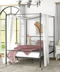Full Size Metal Canopy Bed Frame With Modern Four Poster Silhouette And Sleek Headboard Matte Black Finish featuring a cozy bedroom setting.