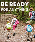 Kids' travel first-aid kit concept: family hiking in a forest with colorful backpacks