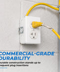 Built Tough 20 Amp Tamper Resistant Duplex Receptacle Outlet 10 Pack on wall with yellow power cord connected.