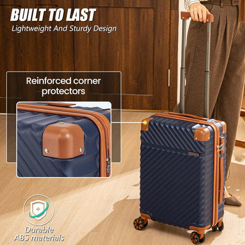 Front view of luggage set: navy blue ABS hard-shell suitcase with orange corner guards and spinner wheels.