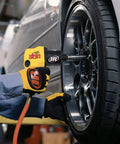 Precision Crafted Half Inch Drive Pneumatic Impact Wrench Producing Six Hundred Twenty Five Foot Pounds Of Torque At Ten Thousand Rpm For Pit Crew Hustle And Grease Monkey Daily Runs in use on a car wheel.