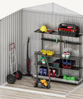 Interior of 6x4 Ft Metal Outdoor Shed With Lockable Doors, Oversized Steel Tool Storage For Backyard Or Patio, showing shelves and tools.