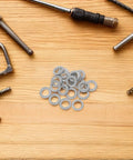 Badass Manganese Steel Wedge Locking Washers 30 Pairs Push On Anti Vibration Anti Loosening Security Fasteners For Bolts Screws Industrial Gear arranged among tools.