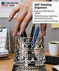 Hand reaching for pen in 360 Degree Rotating Desk Organizer Cup With Silent Swivel on a cluttered office desk.