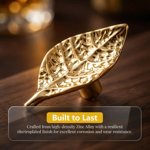 Gold finish Vintage Leaf Cabinet Knobs Set, 4 Pack, Zinc Alloy Drawer Pulls with single hole mount on wooden surface