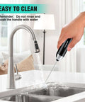Cleaning Powerful Rechargeable Milk Frother Wand With Stand Handheld Electric Foam Maker for Coffee under faucet.