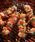 10-inch stainless steel square barbecue skewers on grill with beef chunks and bell peppers; 12-pack