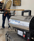 Big 60,000 BTU Portable Propane Forced Air Heater For Outdoor Use in garage with stainless steel build, safety shutoff visible.