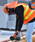 Worker using a grinder, wearing Chainsaw Helmet With Face Shield And Ear Muffs For Logging And Tree Cutting ANSI Certified Forestry Hard Hat
