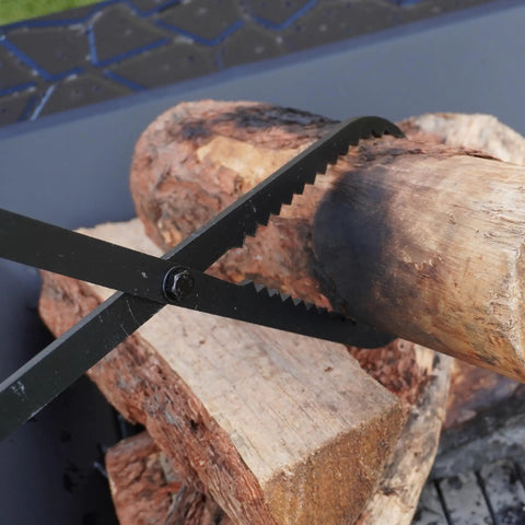 Heavy Duty Collapsible Firewood Tongs 28 Inch Solid Manganese Steel With Serrated Scissor Jaws gripping a log.