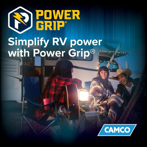 Group of people relaxing by a camper at night, illustrating use of Power Grip 30-Foot 50-Amp Camper RV Extension Cord outdoors.