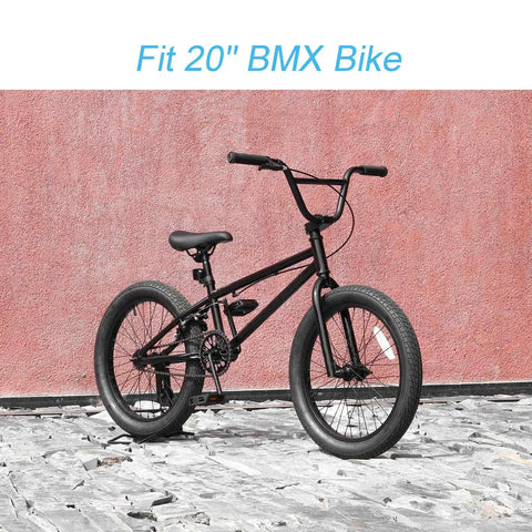 Black BMX bike with 20-inch wheels against pink wall, compatible with Heavy Duty 20 Inch Bike Inner Tubes Kit 2 Pack Fits 20x2.125 To 2.40.