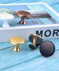 Two Pack Round Drawer Pulls In Red Bronze With Vintage Brushed Antique Copper Finish, assorted metal dresser knobs on table