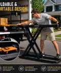 Man using Rock Solid Electric Scissor Lift Table Cart With 660 Lb Capacity And 47 Inch Platform Height for warehouse loading.