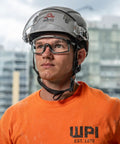 Premium Safety Glasses With Ansi Z87 Plus Impact Rating Featuring Anti Fog Vented Polycarbonate Lenses worn by a worker in an orange shirt.