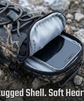 Non Slip Battery Cover Frame Bag For Electric Dirt Bikes open showing phone storage compartment, rugged exterior on rocky ground