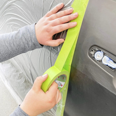 Applying Pro Grade Three Quarters Inch Auto Paint Masking Tape, 55 Meter Green, UV And Solvent Resistant For Pro Refinishing on car