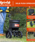 Person using 50 Lb Push Lawn And Garden Broadcast Spreader For Seed And Fertilizer, Walk Behind With No-Fuss Cable Control, Rust Proof Poly Hopper, Toolless Assembly, 10 In Flat Free Tire, Enclosed Gear Box For Smoother Rolling, Built In Side Deflector, Fold Up.