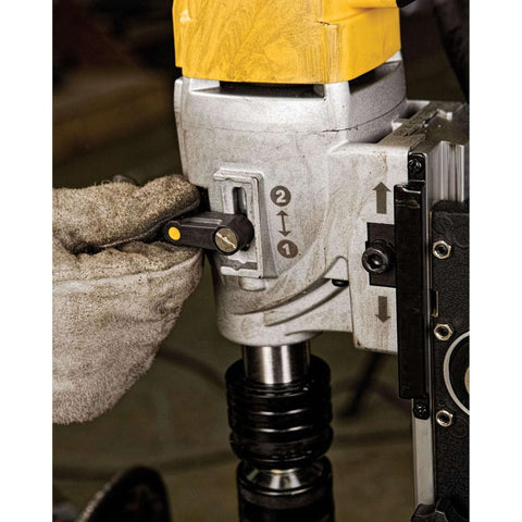 DEWALT magnetic drill press side close-up showing adjustment lever, gray housing, and chuck