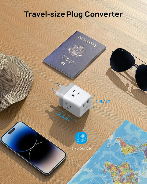 European Travel Plug Adapter With 3 Outlets And 2 USB Ports, International Power Adapter for Europe on table with travel items.
