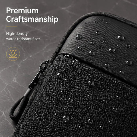 Close-up of ultra compact crossbody sling bag with water-resistant dual pocket chest pack with water droplets on fabric