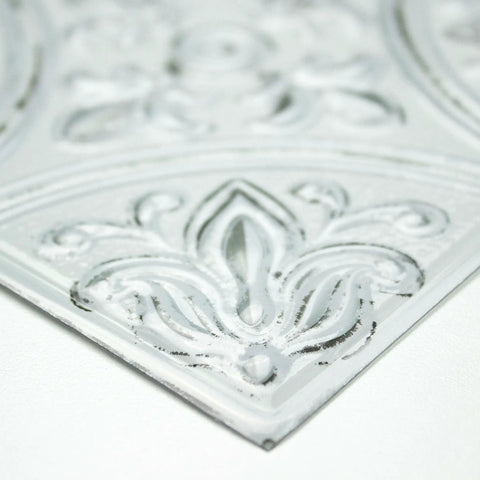 Close-up detail of White Tin Peel And Stick Tile Backsplash Kit With Self Adhesive Tiles, showing embossed Victorian design.