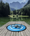Waterproof Portable Foldable Helipad Landing Mat For Drones 22 Inch 55cm on dock by lake with DJI Mavic Pro resting on it
