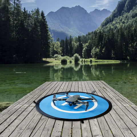 Waterproof Portable Foldable Helipad Landing Mat For Drones 22 Inch 55cm on dock by lake with DJI Mavic Pro resting on it