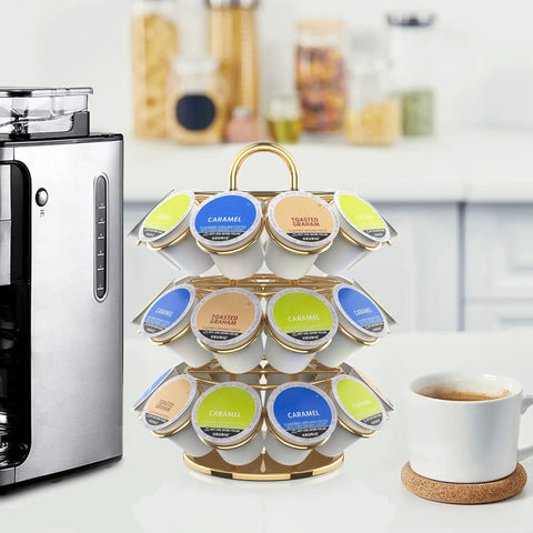Heavy Duty Metal K Cup Pod Organizer Carousel For Home Kitchen Counter Coffee Station, Holds 27 K Cups, Compatible With K Cup Pods And Dolce Gusto, Gold Finish, Sturdy, Rust-Resistant Design on kitchen counter next to coffeemaker.