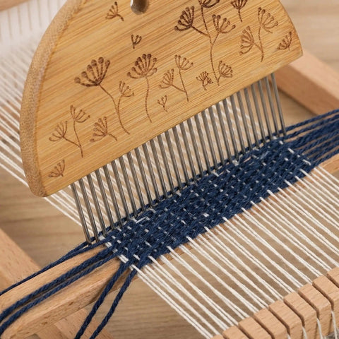 Close-up of weaving comb in use with blue and white yarn, part of Weaving Comb Set for Newbies Three Piece Wood Knitting Loom Tool Kit