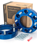 Blue 1.25 Inch Wheel Spacer Kit For Toyota 6 On 5.5 Bolt Pattern Front And Rear visible with box and accessories
