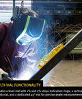 Die Cast Three Vial Torpedo Level With 1 Percent And 2 Percent Slope Rings next to welding worker for precise angles