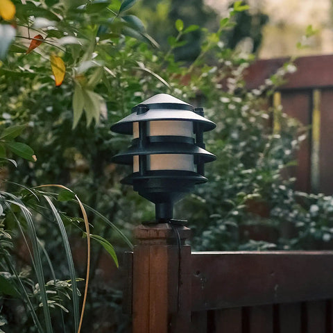 Outdoor fence with low voltage lighting fixture fitted using 4 Pack Metal Landscape Lighting Mounting Brackets With 3/4-14NPSM Threads For Tree Deck And Wall Mounts Outdoor Light Plates That Fit Malibu Low Voltage Fixtures.